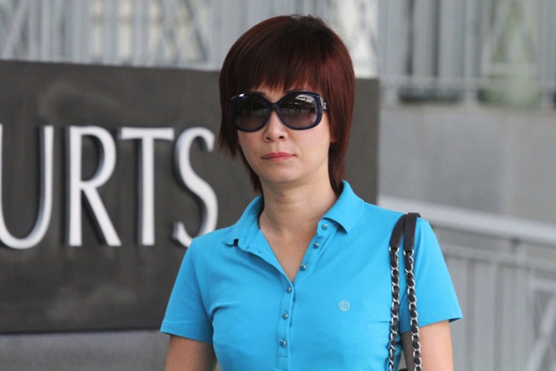 Guan Enmei, former wife of alleged match fixing kingpin Dan Tan, walking into the State Courts to get the verdict for her case on June 13, 2016. u00e2u20acu201du00c2u00a0TODAY pic