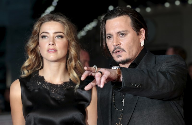 Johnny Depp and his actress wife Amber Heard arrive for the premiere of the British film 'Black Mass' in London, Britain October 11, 2015. u00e2u20acu201d Reuters pic
