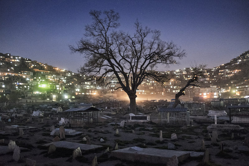 Karte-e-Sakhi cemetery at dawn in Kabul, Afghanistan, April 7, 2016. After decades of war and staggeringly frequent tragedy, more and more Afghan families have some business or another in Kabul’s cemeteries, where an ever-larger slice of everyday life is now centred. — Picture by Adam Ferguson/The New York Times