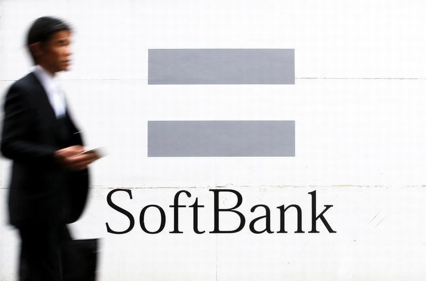 A man walks past the logo of the SoftBank telecommunications company in Tokyo, Japan, June 4, 2016. u00e2u20acu201d Reuters pic