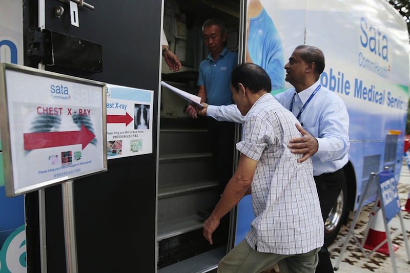 About 230 residents and former residents of Blk 203 Ang Mo Kio Ave 3 have been screened on-site for TB on June 16, 2016. u00e2u20acu201d TODAY pic