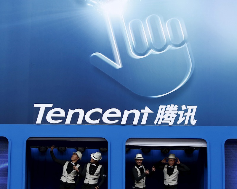 Dancers perform underneath the logo of Tencent at the Global Mobile Internet Conference in Beijing May 6, 2014. u00e2u20acu201d Reuters pic