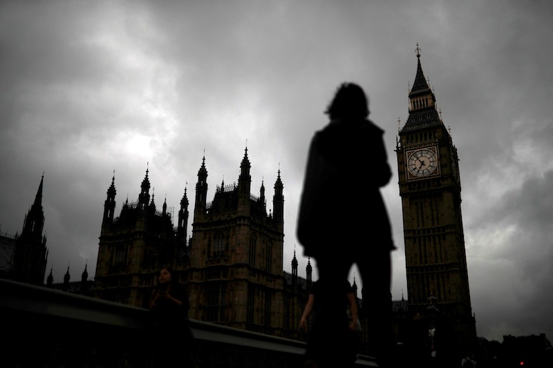 A woman walks past the Houses of Parliament and the Big Ben clock tower, on the day of the EU referendum, in central London, Britain June 23, 2016. u00e2u20acu201d Reuters pic