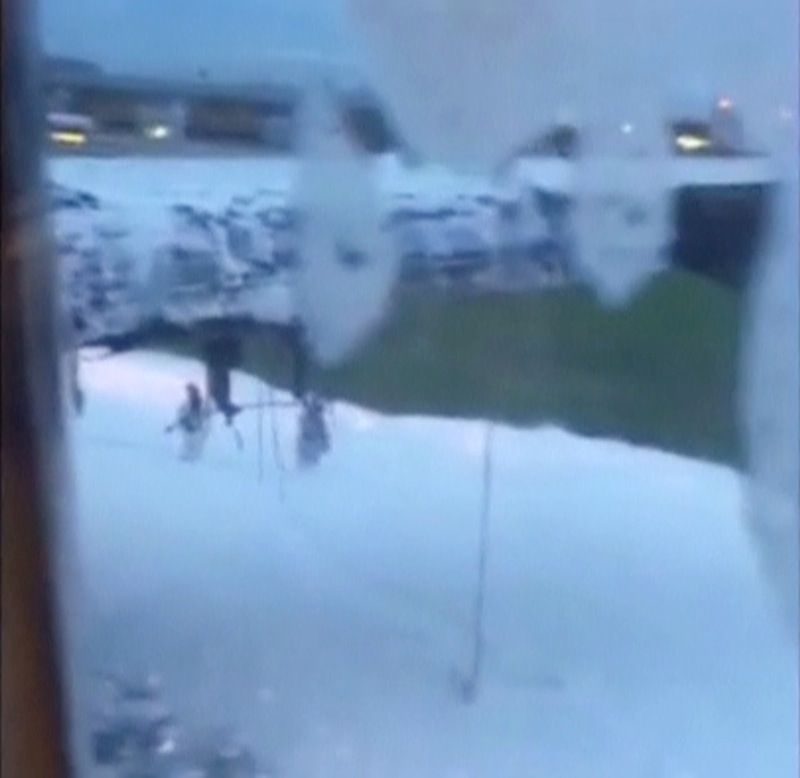 The damaged right wing of a Singapore Airlines Boeing 777-300ER aircraft originally bound for Milan, is seen after a fire was put out, in this still image taken from handout video, at Changi Airport in Singapore June 27, 2016.