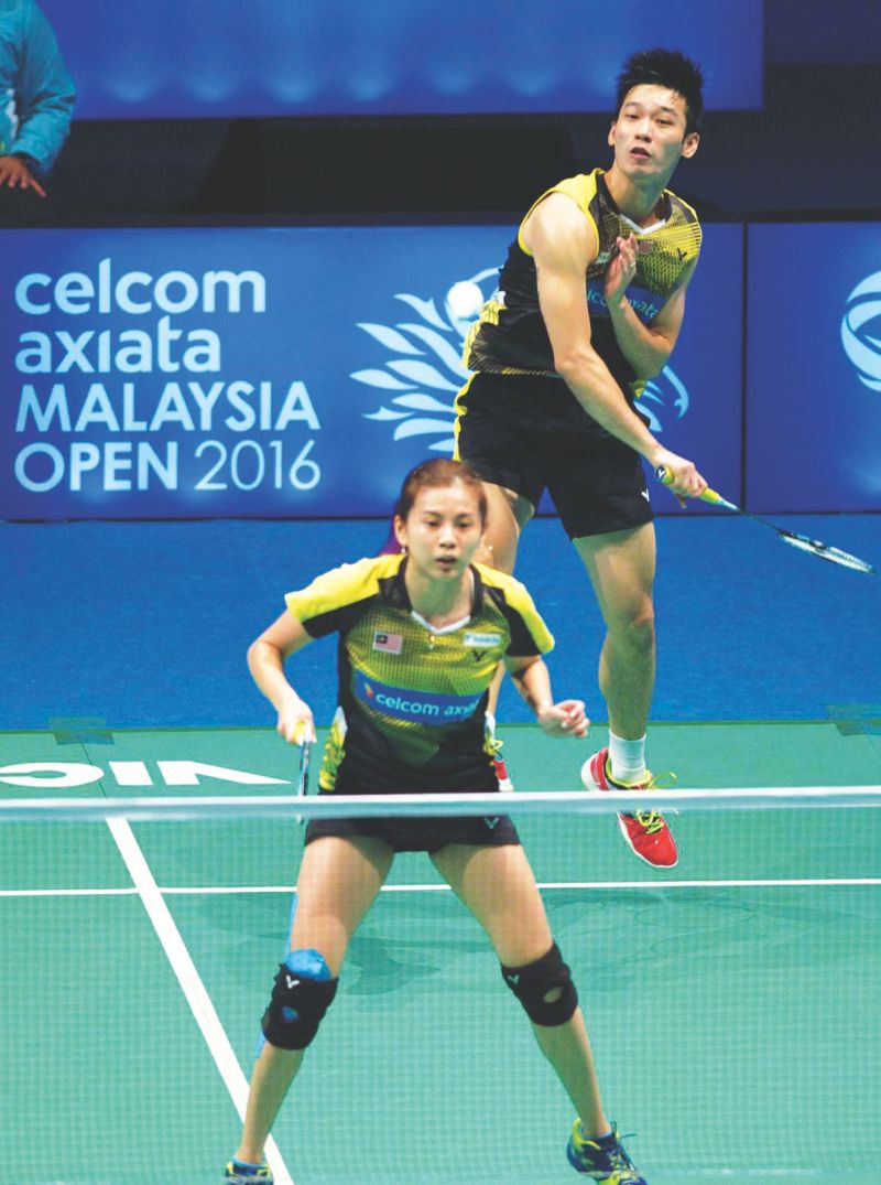 Malaysian mixed doubles badminton player Chan Peng Soon (back) was one of the shuttlers feeling the effects of the Zika vaccine. 