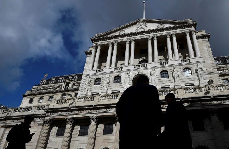 City workers walk past the Bank of England in the City of London in this picture released June 26, 2016. u00e2u20acu201d Reuters pic