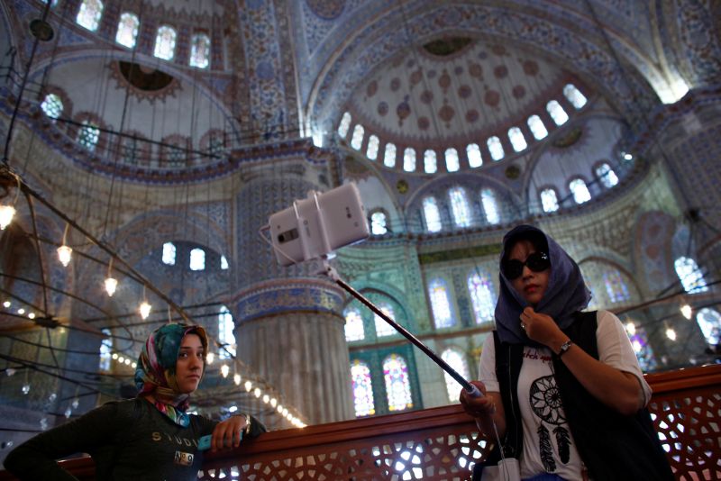 A tourist takes a selfie as she visits the Ottoman-era Sultanahmet mosque, also known as the Blue Mosque, in Istanbul, Turkey, June 11, 2016. u00e2u20acu2022 Reuters pic