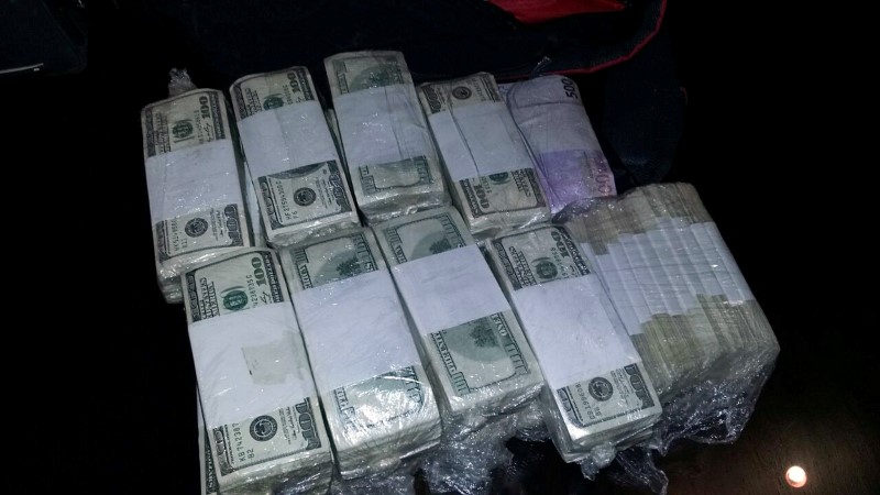 Packets of US American dollars notes in plastic bags in the trunk of a car are seen in this handout picture in Buenos Aires, Argentina, June 14, 2016. u00e2u20acu201d Reuters pic