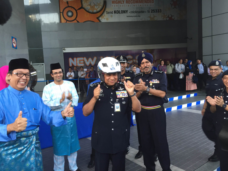 Inspector General of Police (IGP) Tan Sri Khalid Abu Bakar handing over helmets at Menara Celcom, Kuala Lumpur June 29, 2016. u00e2u20acu201d Picture by Kamles Kumar
