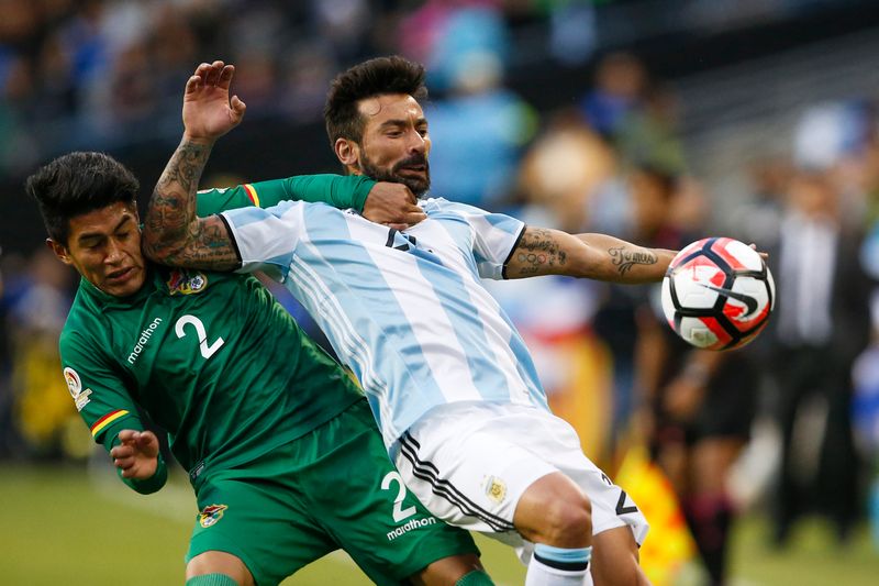 Bolivia defender Erwin Saavedra (left) pulls back Argentina forward Ezequiel Lavezzi in a Copa America Centenario group match in Seattle June 14, 2016. u00e2u20acu201d USA TODAY Sports/Reuters pic