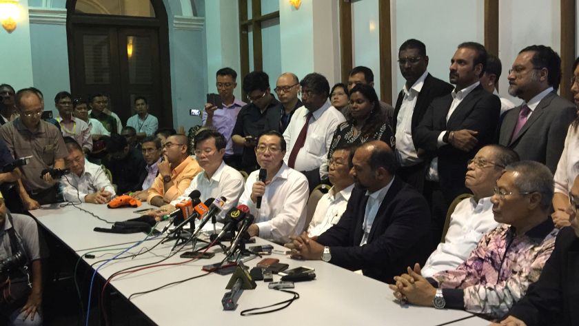 Lim (centre) told a press conference today that he will let the party decide on his position in the state government. u00e2u20acu2022 Picture by Opalyn Mok