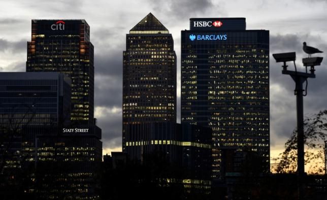 The Canary Wharf financial district is seen at dusk in east London November 7, 2014.nREUTERS/TOBY MELVILLE