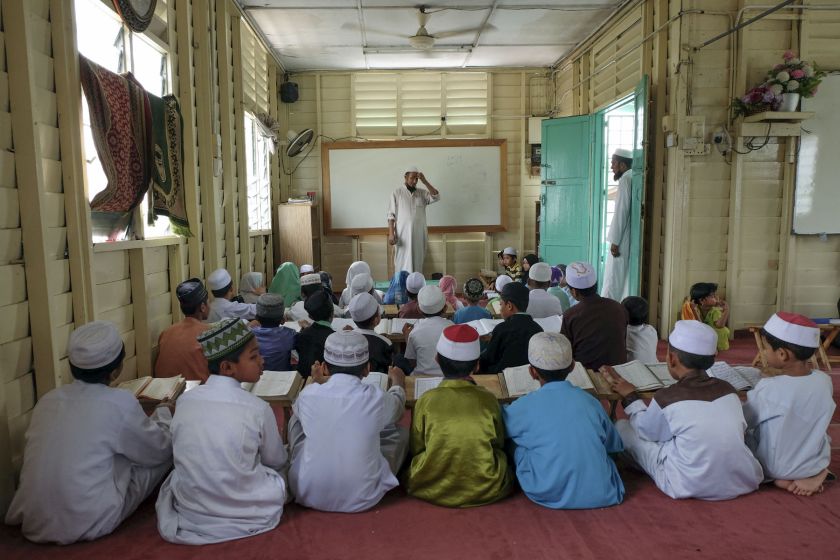 Muslim Rohingya children read the Quran during the holy month of Ramadan in a madrasah in Klang June 28, 2016. u00e2u20acu2022 Picture by Yusof Mat Isa