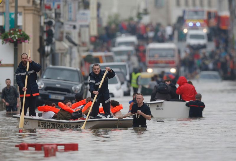 French firefighters on small boats evacuate residents from a flooded area after heavy rainfall in Nemours, France June 1, 2016. u00e2u20acu201d Reuters pic