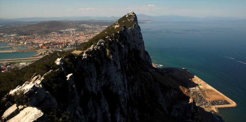 The Spanish city of La Linea de la Concepcion (rear), and the top of the Rock, a monolithic limestone promontory, are seen next to the construction (right) of Cape Vantage, in the British overseas territory of Gibraltar August 16, 2013. u00e2u20acu201d Reuters pic