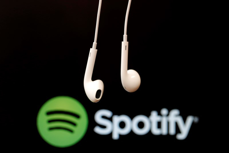 Headphones are seen in front of a logo of online music streaming service Spotify in this illustration picture taken in Strasbourg, February 18, 2014. u00e2u20acu201d Reuters pic