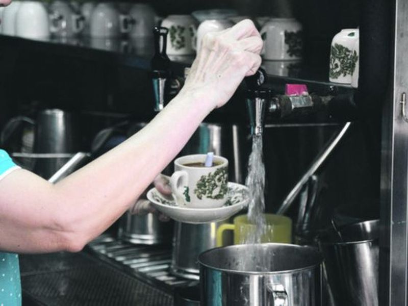 The 62-year-old owner of Xiao Xiao Coffee House Goh Hwee Moy preparing a cup of coffee. u00e2u20acu2022 Picture by Rachel Kwek/TODAY
