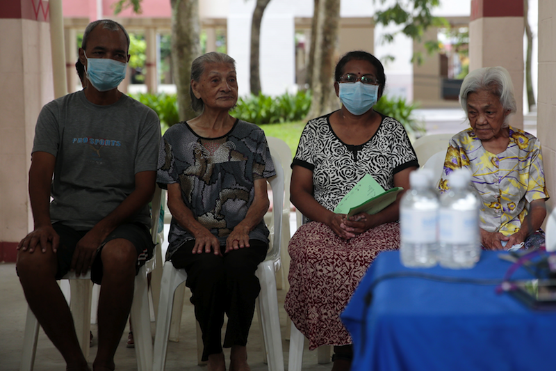 Residents and former residents of Block 203 Ang Mo Kio Avenue 3 waiting to be screened. u00e2u20acu201d TODAY pic