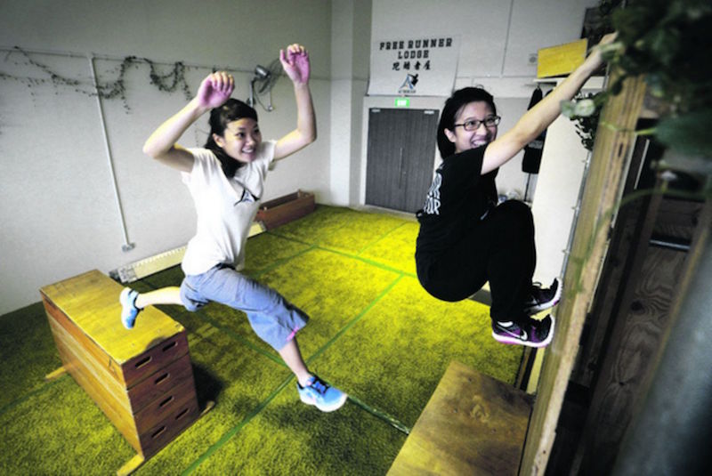 Julia Kong (white shirt) and Chee En Jia show off their moves at the A2 Movements Free Runner Lodge gym. — TODAY pic