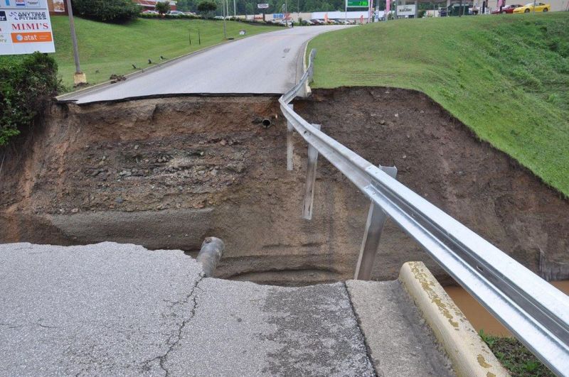 The chasm that was once the culvert crossing at Elkview Crossings Mall.