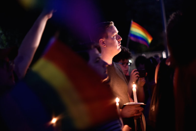 People gather outside the White House for a vigil on Pennsylvania Avenue later in the day of the worst mass shooting in U.S. history at a gay nightclub in Orlando, Florida in Washington June 12, 2016. REUTERS/James Lawler Duggann