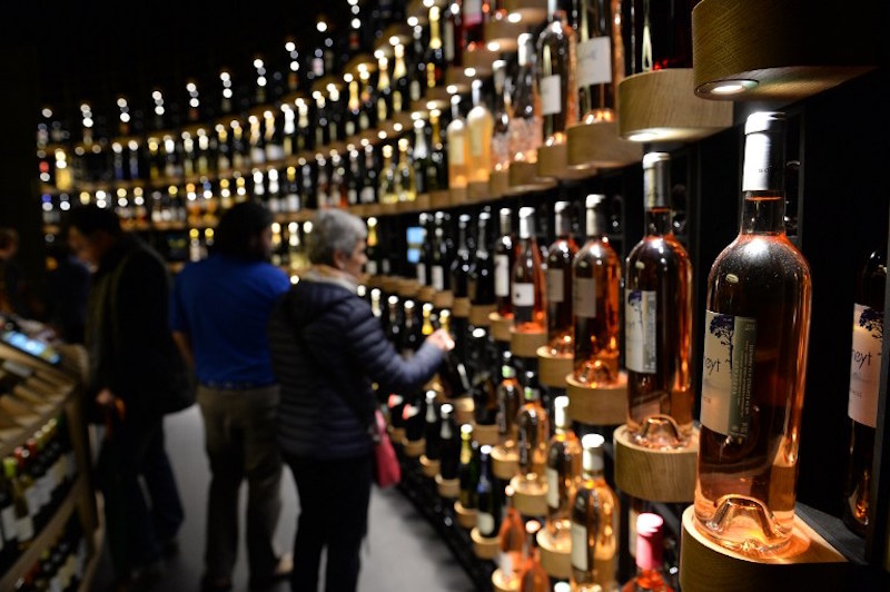 People look at bottles of wine as they visit La Cite du Vin (Wine Museum) during the public opening in Bordeaux June 1, 2016. u00e2u20acu201d AFP pic