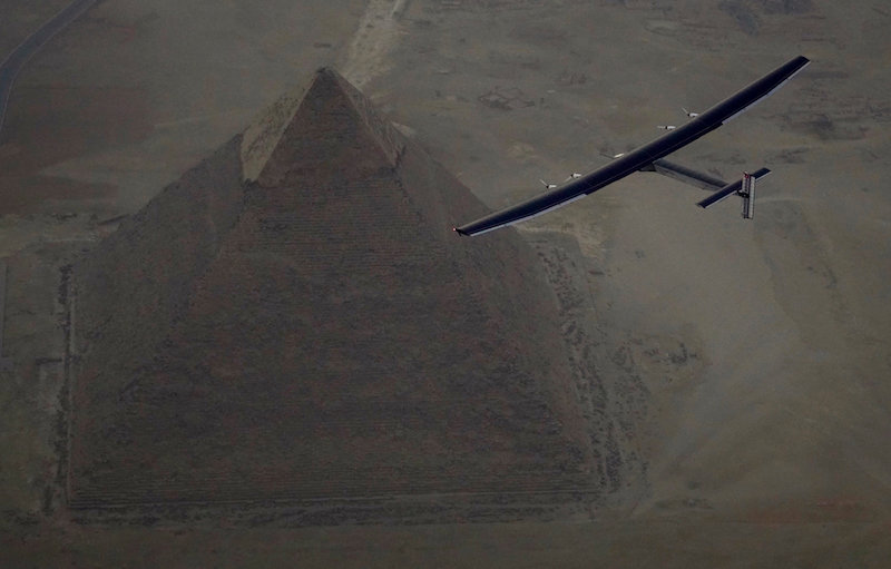 Solar Impulse 2, the solar powered plane, piloted by Swiss pioneer Andre Borschberg is seen during the flyover of the pyramids of Giza on July 13, 2016 prior to the landing in Cairo. u00e2u20acu201d Reuters pic