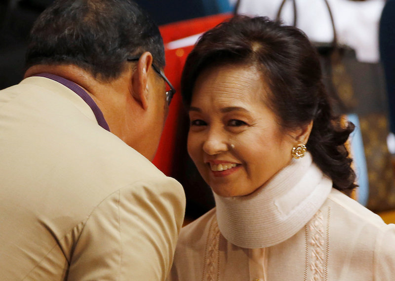 Former president and congresswoman Gloria Macapagal Arroyo talks to a fellow lawmaker shortly before the opening of the Philippine Congress, ahead of the State of the Nation address by President Rodrigo Duterte, in Quezon city July 25, 2016. u00e2u20acu201d Reuters p
