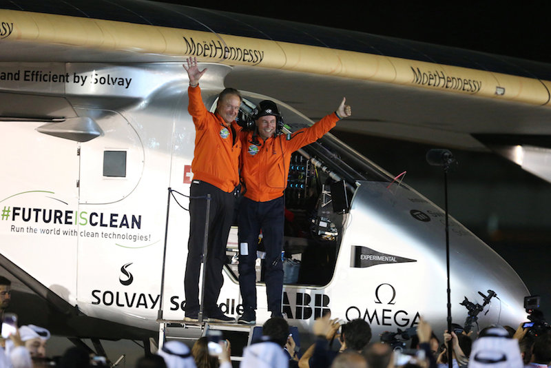 Pilots Andre Borschberg (left) and Bertrand Piccard celebrate after their arrival on Solar Impulse 2, a solar powered plane, at an airport in Abu Dhabi July 26, 2016. u00e2u20acu201d Reuters pic
