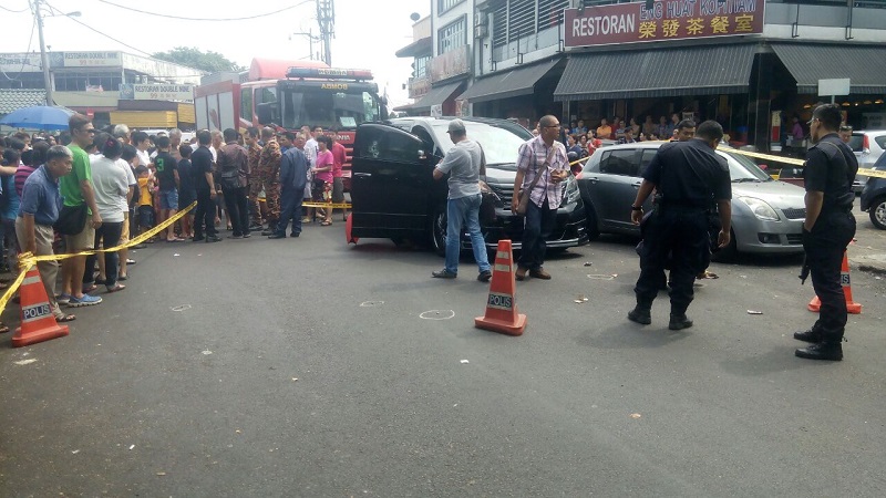 Police inspect the multi-purpose vehicle in which the body of a 32-year old woman was found, at Taman OUG, Kuala Lumpur July 6, 2016. u00e2u20acu201d Picture courtesy of Fire and Rescue Department 