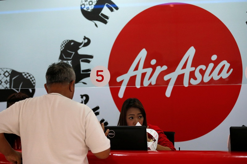 A passenger waits to check in at AirAsia counters for a flight at Don Muang International Airport in Bangkok, Thailand, June 14, 2016. u00e2u20acu201d Reuters pic