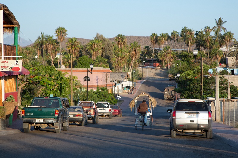 A vendor rides away on his trike in the small town of Todos Santos, Mexico, July 7, 2016. 