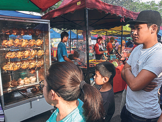 A pasar Ramadan where many Muslims buy food for the breaking of fast but not every Muslim fasts during this month -- not because they don’t want to but because they cannot. — Mohd Yusof Mat Isa/MMO
