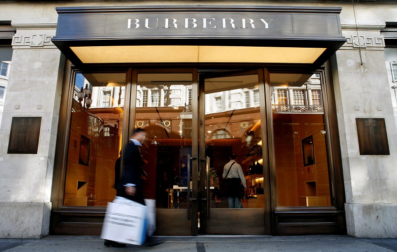 A customer walks in front of a Burberry store in central London in this July 15, 2008 file picture. u00e2u20acu201d Reuters pic