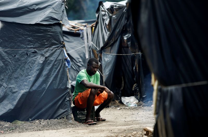 An African migrant stranded in Costa Rica sits outside his tent in a makeshift camp at the border between Costa Rica and Nicaragua, in Penas Blancas, Costa Rica July 15, 2016. u00e2u20acu2022 Reuters pic