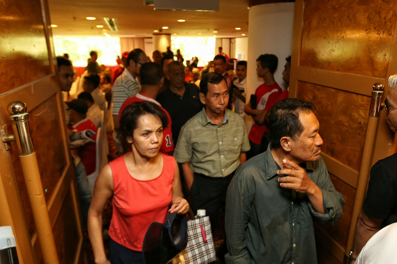 Attendees walk out of the u00e2u20acu02dcNothing to hide 2.0u00e2u20acu2122 forum organised by Jaringan Melayu Malaysia after discovering that Tan Sri Muhyiddin Yassin will not be attending the event held in Kelab Darul Ehsan, Ampang July 3, 2016. u00e2u20acu201d Picture by Saw Siow Feng