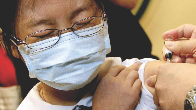 A student receives an immunisation shot. The deaths of two schoolchildren last week have prompted the government to consider a mandatory vaccination regime. u00e2u20acu201d Malay Mail pic