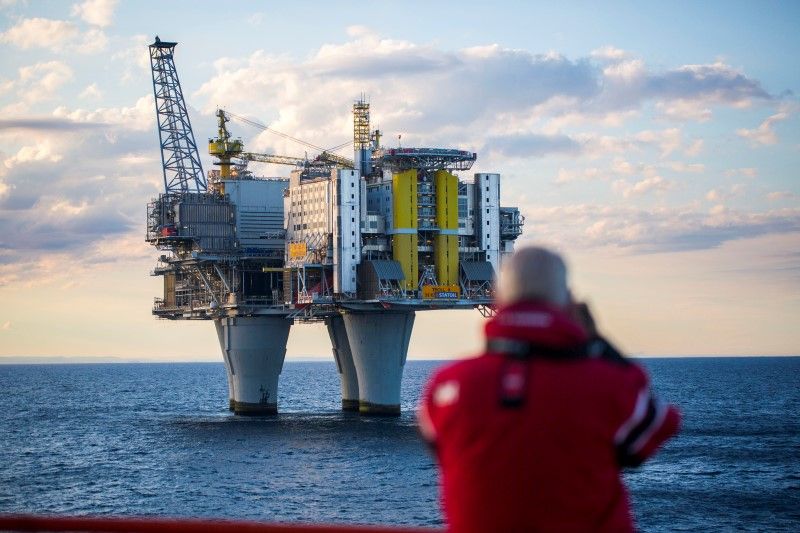 A man looks on oil platform during a cruise in the North Sea, Norway, in this handout picture July 21, 2016. u00e2u20acu2022 Picture by Thomas Mortveit/ Edda Accommodation/Handout via Reuters