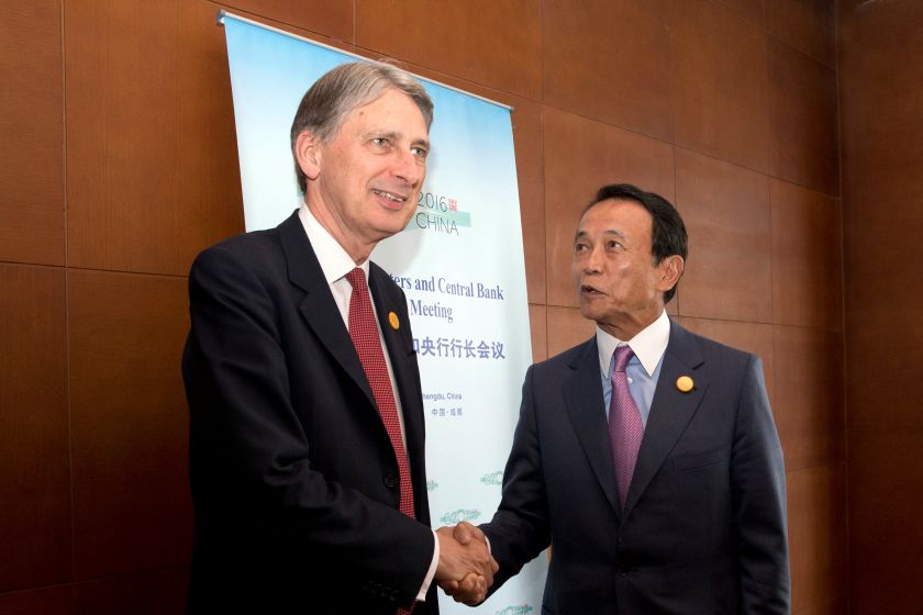 Britainu00e2u20acu2122s Chancellor of the Exchequer Philip Hammond shakes hands with Taro Aso, Japanu00e2u20acu2122s Deputy Prime Minister during a meeting at the G20 Finance Ministers and Central Bank Governors conference held in Chengdu July 23, 2016. u00e2u20acu201d Reuters pic