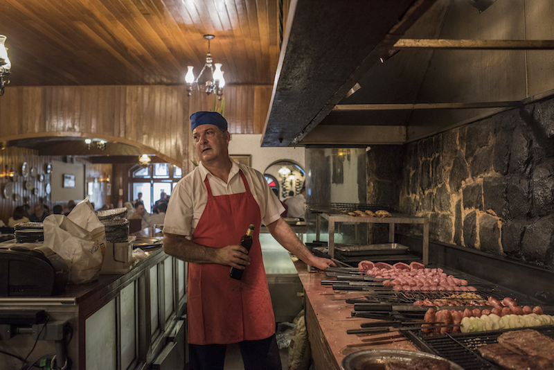 Francisco Geraldo, Churrascaria Majoricau00e2u20acu2122s grill master, has a huge grill as the centrepiece of the salon in Rio de Janeiro July 6, 2016. u00e2u20acu201d Picture by Andre Vieira/The New York Times