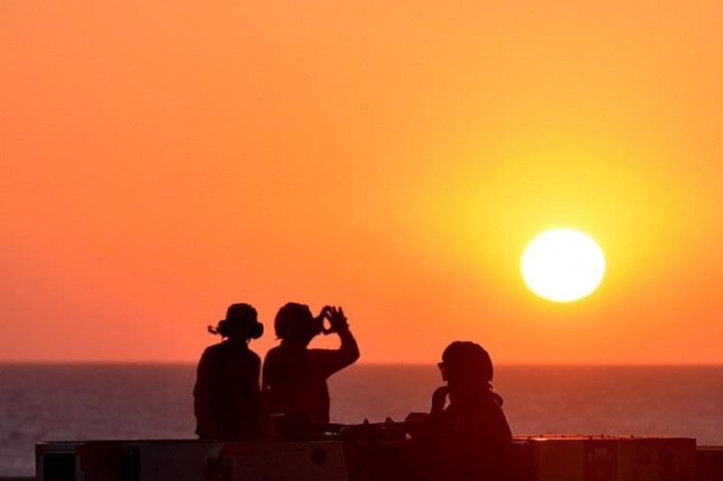 Sailors look at sunset on the US navyu00e2u20acu2122s super carrier USS Dwight D. Eisenhower (CVN-69) in the Mediterranean Sea July 6, 2016. u00e2u20acu201d AFP pic