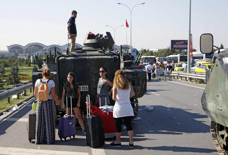 File picture shows women standing behind a military vehicle in front of Sabiha Airport, in Istanbul, Turkey July 16, 2016. u00e2u20acu201d Reuters pic