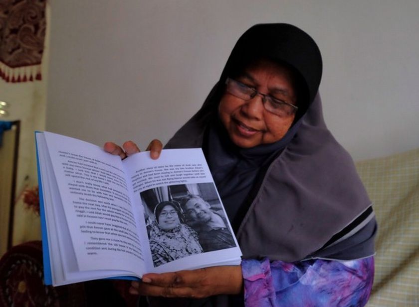 Wan Aini says the book was written in honour of her brother.  u00e2u20acu201d Picture by Farhan Najib