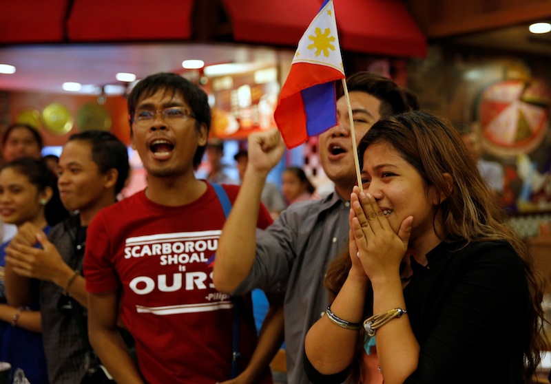 Activists who travelled to contested Scarborough Shoal react after a ruling on the South China Sea by an arbitration court in Hague at a restaurant in Manila, Philippines July 12, 2016. u00e2u20acu201d Reuters pic