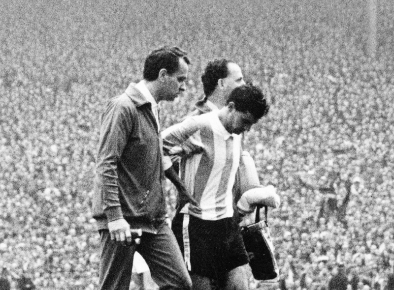Argentinian team captain and midfielder Antonio Rattin bows his head as he walked off the field after being sent off by German referee Rudolf Kreitlein 23 July 1966 at Wembley stadium, London. u00e2u20acu201d AFP pic