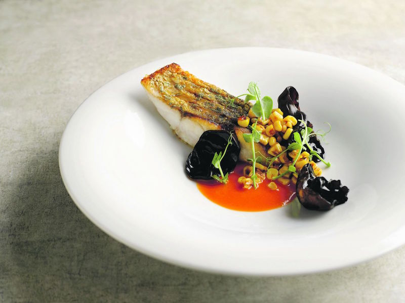 Ah Hua Kelong Sea Bass with tomato butter and charred local corn for Restaurant Ember. u00e2u20acu201d Handout via TODAY