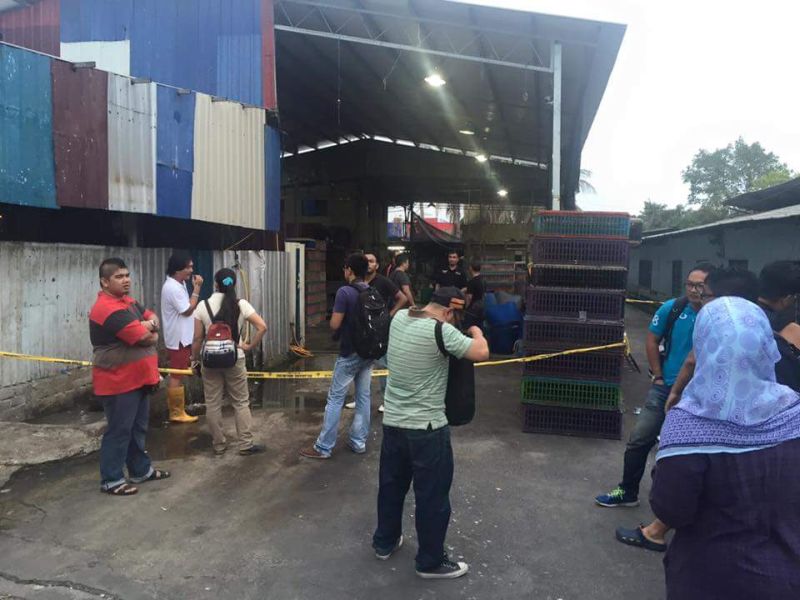 A yellow police tape marks the crime scene at a poultry processing plant in Jalan Batu Maung, Penang, where a family of four were shot dead at 2.45am today. u00e2u20acu2022 Picture courtesy of the Penang policen