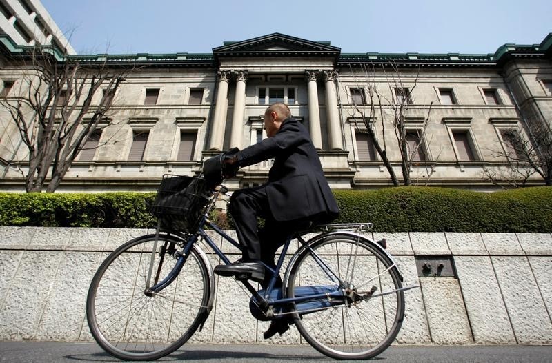 A man rides a bicycle past the Bank of Japan (BOJ) building in Tokyo March 18, 2009. u00e2u20acu201d Reuters pic