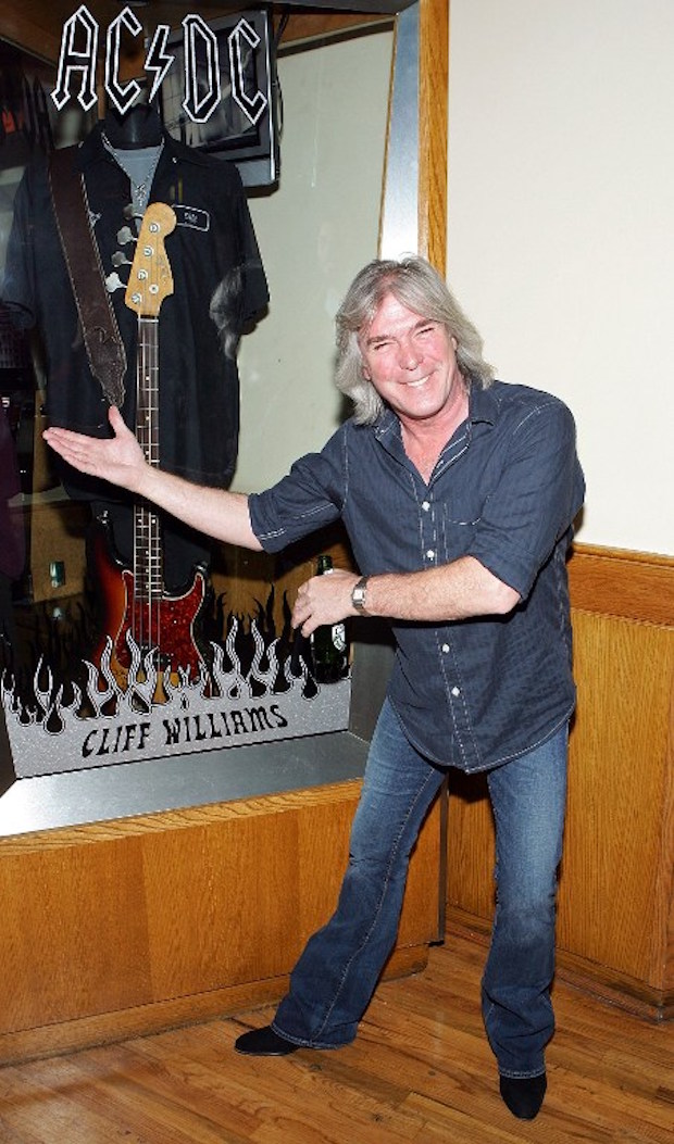 AC/DC bassist Cliff Williams unveils a memorabilia case in his honour during a dedication ceremony at the Hard Rock Hotel & Casino in Las Vegas December 7, 2006. u00e2u20acu201d AFP pic