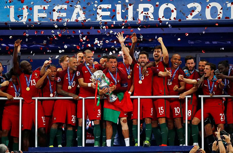 Portugalu00e2u20acu2122s Cristiano Ronaldo celebrates with team mates and the trophy after winning Euro 2016, Paris July 11, 2016. u00e2u20acu201d Reuters pic